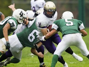 Vancouver College fullback Jasper Schiedel bears down on the Lord Tweedsmuir defence Friday during AAA B.C. high school football action in Surrey. (Gerry Kahrmann, PNG photo)