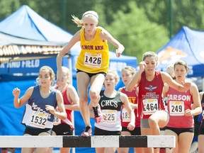Salmon Arm Jewels' steeplechase star Glynis Sim on her way to a gold medal at last June's BC high school track and field championships. (Wilson Wong, UBC athletics)