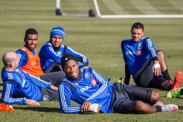 MONTREAL, QUE.: NOVEMBER 4, 2015 -- Montreal Impact forward Didier Drogba, foreground, rests after taking part in a team practice in Montreal on Wednesday, November 4, 2015. The Impact will face Columbus Crew on November 8 for game two of their conference semifinals. (Dario Ayala / Montreal Gazette)