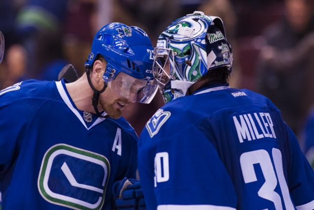 VANCOUVER, BC - NOVEMBER 21: Daniel Sedin #22 of the Vancouver Canucks congratulates goalie Ryan Miller #30 after defeating the Chicago Blackhawks 6-3 in NHL action on November, 21, 2015 at Rogers Arena in Vancouver, British Columbia, Canada.  (Photo by Rich Lam/Getty Images)