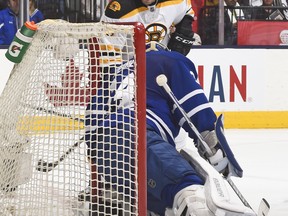 Landon Ferraro of the Boston Bruins goes to the net against James Reimer of the Toronto Maple Leafs during NHL game action November 23, 2015 at Air Canada Centre in Toronto, Ontario, Canada. (Photo by Graig Abel/NHLI  via Getty Images)