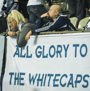 VANCOUVER, BC: November 8, 2015 -- Vancouver Whitecaps fans sit dejected after their club lost to the Portland Timbers 2 - 0 in the second leg of the MLS Western Conference semifinal match at B.C. Place Stadium in Vancouver, B.C. Sunday November 8, 2015. (Photo by Ric Ernst/ PNG) (see story by sports) TRAX #: 00039954A & 00039954B [PNG Merlin Archive]