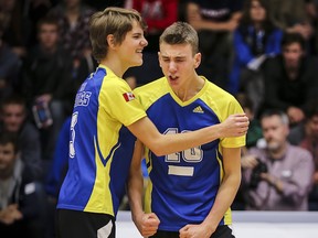 MEI Eagles’ power-hitter and provincial first team all-star Kaden Gamache (right) is congratulated by teammate Brendan Loewen after registering a big point during Saturday’s 3-0 win over the Langley Fundamental Titans in the Big Kahuna B.C. senior boys Double A championship final played before a packed house on centre court at the Langley Events Centre. (Photo — Paul Yates, Vancouver Sports Pictures)