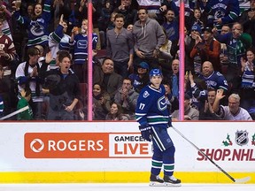 Canucks fans celebrate during the recent win over Buffalo.