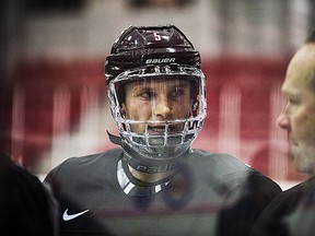 Jakob Chychrun talks to head coach Dave Lowry during a Canadian World Junior Hockey team practice in Toronto on Thursday.