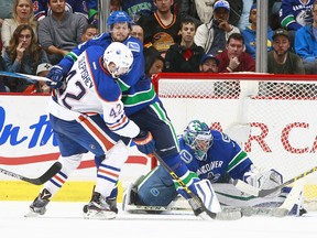 Ryan Miller guarded Vancouver's net  in this Oct. 18 game versus the Oilers. He didn't take the morning skate Saturday prior to Edmonton's visit to Vancouver, though. (Getty Images Files.)