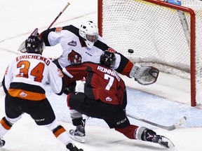 Ty Ronning of the Vancouver Giants scores his hat-trick goal against goaltender Mack Shields #30 of the Medicine Hat Tigers during the third period of their WHL game at the Pacific Coliseum on December 2, 2015 in Vancouver, British Columbia, Canada. (Photo by Ben Nelms/Getty Images)