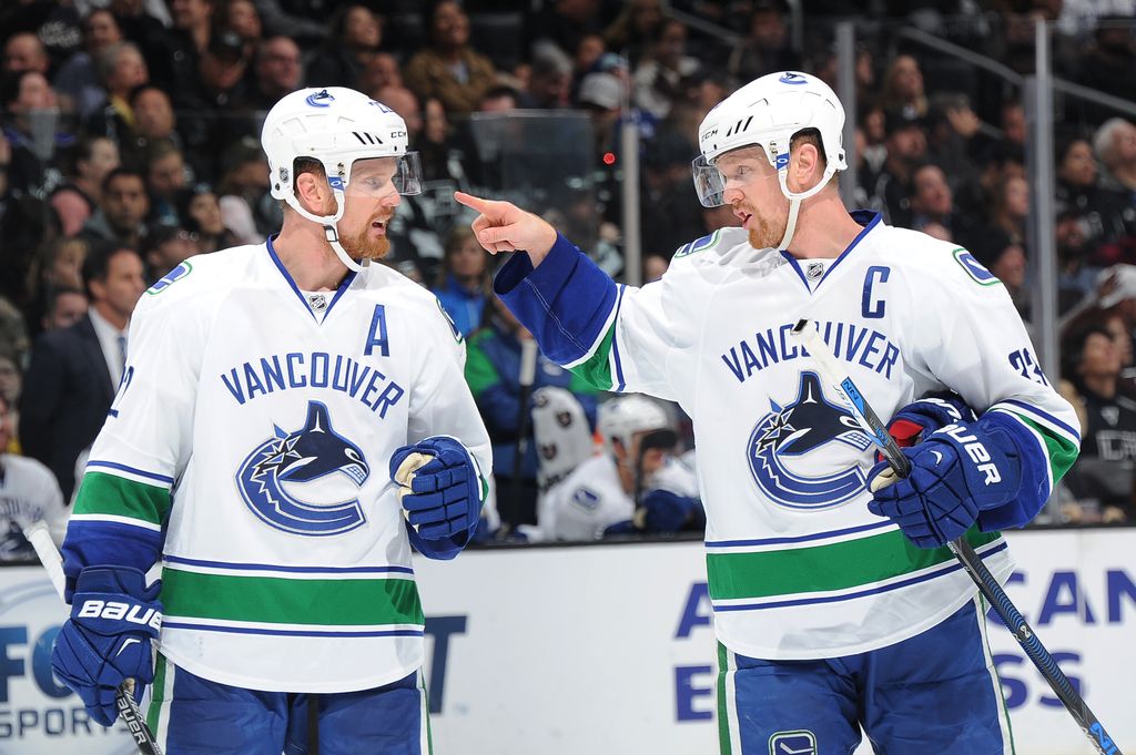 LOS ANGELES, CA - DECEMBER 01: Henrik Sedin #33 converses with Daniel Sedin #22 of the Vancouver Canucks at STAPLES Center on December 01, 2015 in Los Angeles, California. (Photo by Aaron Poole/NHLI via Getty Images) *** Local Caption ***