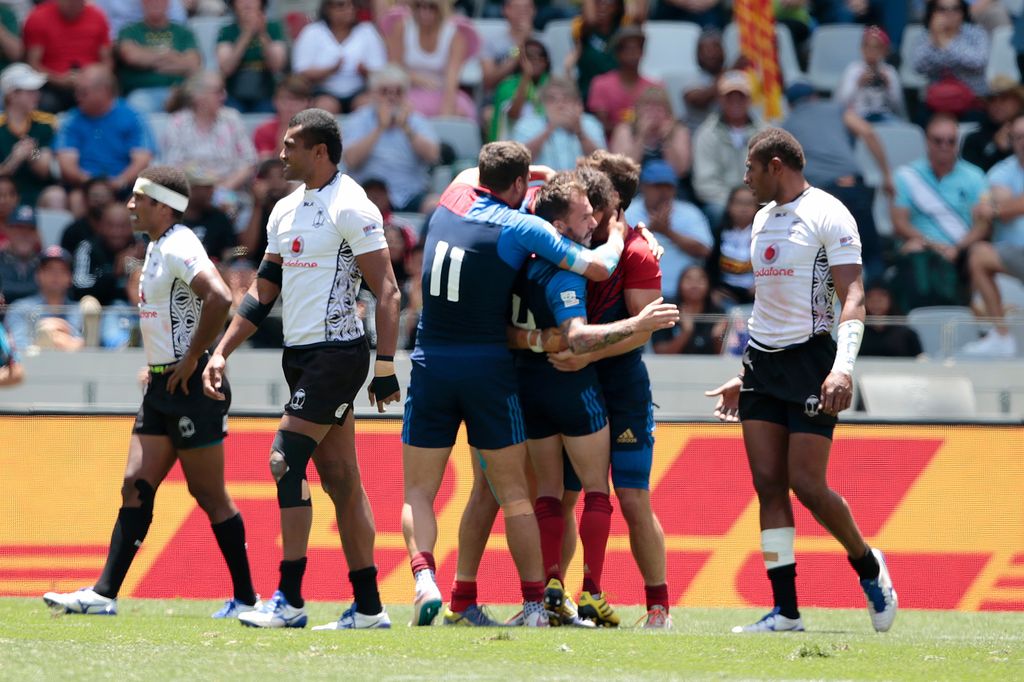 France players celebrate after beating Fiji during the Rugby Sevens series Cape Town leg on December 13, 2015 at the Cape Town stadium in Cape Town, South Africa.  / AFP / GIANLUIGI GUERCIA        (Photo credit should read GIANLUIGI GUERCIA/AFP/Getty Images)