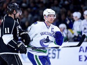 Henrik Sedin and Anze Kopitar could be clashing again tonight at Rogers Arena. Sedin, who missed the Canucks' practice on Sunday, took the morning skate today and says he'll play against the Kings. (Getty Images Files.)
