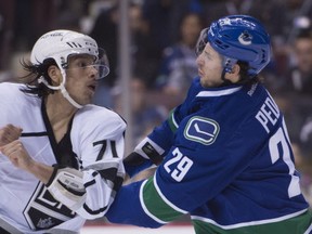 Vancouver Canucks defenceman Andrey Pedan (29) fights with Los Angeles Kings centre Jordan Nolan (71) during first period NHL action Vancouver, B.C. Monday, Dec. 28, 2015. THE CANADIAN PRESS/Jonathan Hayward