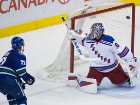 A third period push, powered by Rangers penalties, saw Daniel Sedin and the Canucks home. THE CANADIAN PRESS/Darryl Dyck