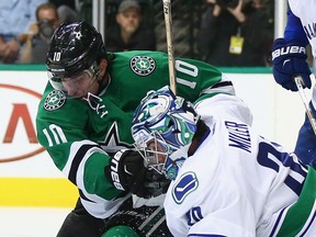 Patrick Sharp of the Stars battles with Canucks goalie Ryan Miller during Vancouver's visit to Dallas on Oct. 29. Vancouver lost that game 4-3 in overtime. (Getty Images.)