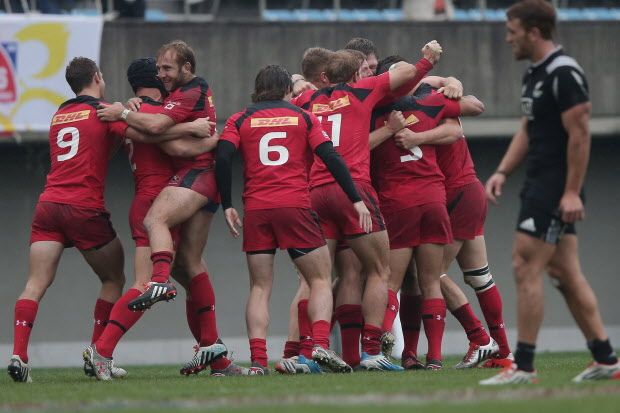 TOKYO, JAPAN - APRIL 05: Canada players celebrate victory over New Zealand during the match between New Zealand and Canada during day two of the Tokyo Sevens Rugby 2015 at Chichibunomiya Rugby Stadium on April 5, 2015 in Tokyo, Japan.  (Photo by Chris McGrath/Getty Images)