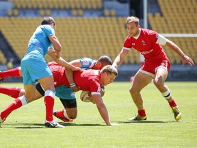 John Moonlight of Canada is tackled during the 2016 Wellington Sevens bowl quarter-final match between Canada and Russia at Westpac Stadium on Jan. 31, 2016 in  New Zealand.  (Photo by Hagen Hopkins/Getty Images)