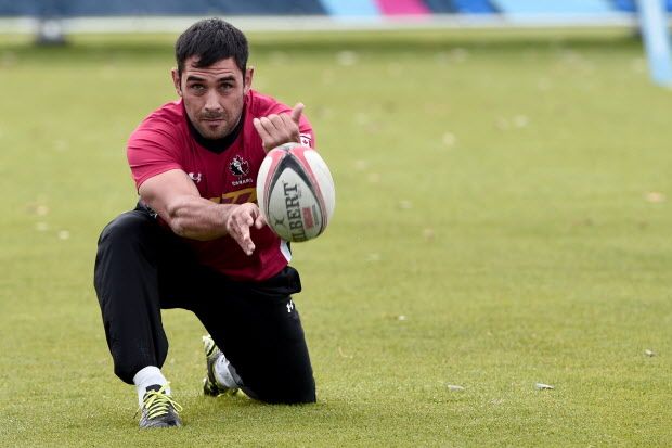 Canada's scrum-half Phil Mack passes the ball    during a training session at Swansea university, on September 15, 2015, ahead of the 2015 Rugby Union World Cup. The 2015 Rugby World Cup starts on September 18.  AFP PHOTO / DAMIEN MEYERDAMIEN MEYER/AFP/Getty Images