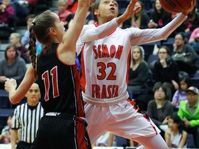 Simon Fraser Clan guard Alisha Roberts (right) drives to the hoop past Western Oregon Wolves’ Jordan Mottershaw during NCAA basketball contest played Saturday atop Burnaby Mountain. The Clan moved to 7-5 on the conference season with a 66-59 victory. (Ron Hole, SFU athletics)