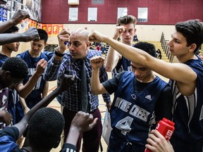 Byrne Creek head coach Balraj Dhillon breaks the huddle with his AAA No. 6-ranked Bulldogs on Monday in their game at Burnaby Central. (PNG photo by Carmine Marinelli)