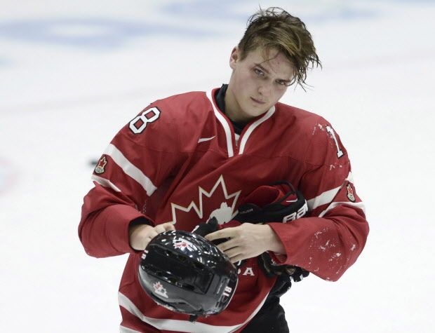 Canada's Jake Virtanen looks on, during the 2016 World Junior  Hockey Championships tournament match between Switzerland and Canada in Helsinki, Finland, Tuesday, Dec. 29, 2015. (Heikki Saukkomaa/Lehtikuva via AP)  FINLAND OUT