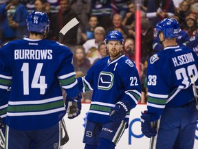 It looks like Alex Burrows will be reunited on a line with Daniel and Henrk Sedin tonight when the Canucks face the Lightning. (Photo by Rich Lam/Getty Images)