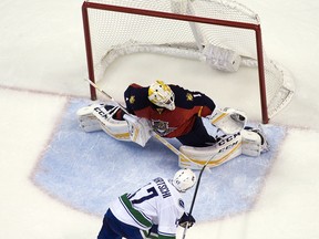 Roberto Luongo of the Florida Panthers makes a save in a shoot-out against Sven Baertschi of the Vancouver Canucks on December 20, 2015 in Sunrise, Florida. Florida won the game 5-4. (Photo by Eliot J. Schechter/NHLI via Getty Images)