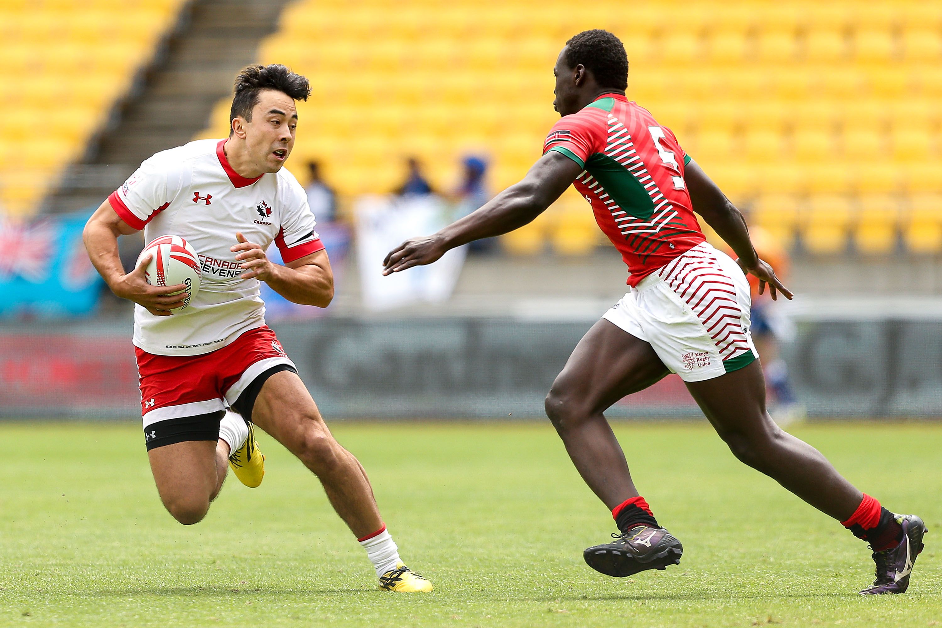 WELLINGTON, NEW ZEALAND - JANUARY 30:  Nathan Hirayama of Canada is challenged by Billy Odhiambo of Kenya during the 2016 Wellington Sevens pool match between Kenya and Canada at Westpac Stadium on January 30, 2016 in Wellington, New Zealand.  (Photo by Hagen Hopkins/Getty Images)