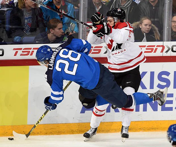 Canada's Jake Virtanen (18) tries to knock Finland's Juho Lammikko off the puck during the quarterfinal of the IIHF World Junior Championship, in Helsinki, Finland, on Saturday. He took three penalties in the game, including two crucial ones in the third that led to Finland's game winner.
