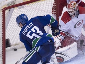 Bo Horvat slips one past Eddie Lack on Wednesday night at Rogers Arena.