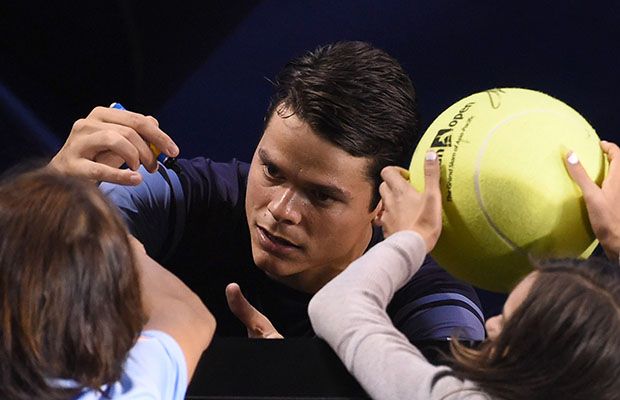 Milos Raonic signs  a few autographs after downing France's Gael Montfils in the Australian Open quarterfinals earlier today.