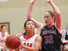 SFU's Vanessa Gee (left) drives to the basket against Central Washington's Mandy Steward during GNAC contest Thursday atop Burnaby Mountain. (Ron Hole, SFU athletics)