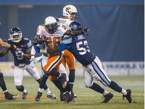 Chris Rainey will be breaking tackles again this season for the B.C. Lions. (Province Files.)
