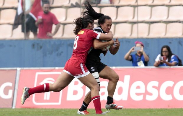 Portia Woodman (R) of New Zeland vies for the ball with Bianca Farella of Canada during their World Rugby Women's Sevens Series match in Barueri, some 30 km from Sao Paulo, Brazil on February 21, 2016. AFP PHOTO / Miguel SCHINCARIOLMiguel Schincariol/AFP/Getty Images