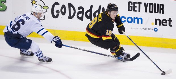 VANCOUVER February 13 2016. Vancouver Canucks #18 Jake Virtanen keeps the puck from  Toronto Maple Leafs #15 Pierre-Alexander Parenteau in the third period of a regular season NHL hockey game at Rogers Arena, Vancouver, February 13 2016.  Gerry Kahrmann  /  PNG staff photo) / PNG staff photo) ( For Prov / Sun Sports ) 00041674A  [PNG Merlin Archive]