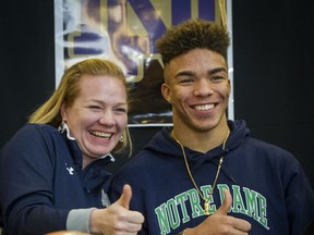 Moments after signing his national Letter of Intent to play football at famed Notre Dame next season, Abbotsford Panthers star wideout Chase Claypool and his mom Jasmine signalled their joy. (Ric Ernst, PNG)