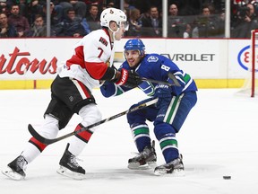 Kyle Turris of Ottawa and Chris Tanev of Vancouver get to get after it again tonight when the Senators visit the Canucks. (Getty Images File.)