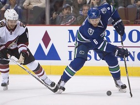 Defenceman Yannick Weber (right, battling with the Coyotes' Max Domi last month) was set to go on waivers as the Vancouver Canucks prepared for the return of Dan Hamhuis from injury this weekend. (Jonathan Hayward, CP files)