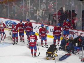 P.K. Subban of the Montreal Canadiens is tended to by medical and training staff after sustaining an injury against the Buffalo Sabres in the third period in Montreal Thursday.