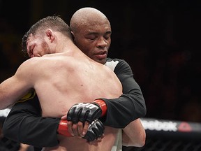 Let's go ahead and hug it out: The UFC is making some smart moves these days. Pictured are Michael Bisping embracing Anderson Silva after their middleweight bout at the UFC Fight Night event in London on Feb. 27, 2016. (AFP/Getty Images files)