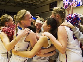 Brookswood Bobcats embrace after team effort nets Langley squad third straight BC girls Triple A title. (Gerry Kahrmann, PNG)