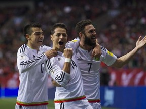 Hirving Lozano, #14 Javier Hernandez and #7 Miguel Layun celebrate their first goal against Canada in a FIFA World Cup soccer qualifier at BC Place,  Vancouver March 25 2016.  Gerry Kahrmann  /  PNG staff photo)