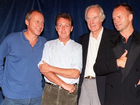 From left: Mark Knopfler, Paul McCartney, George Martin and Sting are photographed prior to the start of the Music for Montserrat benefit concert, in London, in 1997.