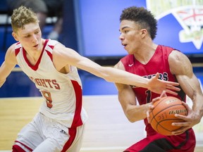 Abbotsford's Chase Claypool (right) scored 39 points Thursday but Cam Morris and the STM Knights prevailed to grad a 3A Final Four berth. (Ric Ernst, PNG)