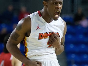 Calgary's Thomas Cooper exulting during Thursday quarterfinal win, calls his Dinos and the Ryerson Rams "the same team." (PNG photo by Gerry Kahrmann)
