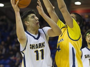 Steveston-London's Fardaws Aimaq (left) shoots over Rick Hansen's Ish Birk on Friday at the LEC. (Richard Lam, PNG photo)