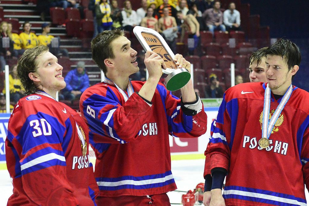 Russia's Nikita Tryamkin (C) raises the bronze trophy next to Andrei Vasilevski (L) after winning the World Junior Ice Hockey Championships bronze match against Canada at Malmo Arena in Malmo, Sweden on January 5, 2014. Russia won 2-1. AFP PHOTO / TT NEWS AGENCY / LUDVIG THUNMAN +++ SWEDEN OUT +++ (Photo credit should read LUDVIG THUNMAN/AFP/Getty Images)