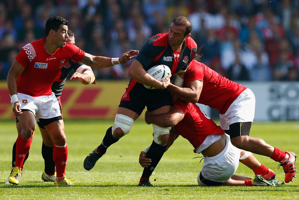 GLOUCESTER, ENGLAND - SEPTEMBER 19:  Georgia captain Mamuka Gorgodze is tackled by the Tonga defence during the 2015 Rugby World Cup Pool C match between Tonga and Georgia at Kingsholm Stadium on September 19, 2015 in Gloucester, United Kingdom.  (Photo by Harry Engels/Getty Images)