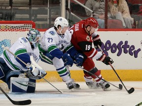 Shane Doan drives to the net against Ben Hutton and Ryan Miller in a Canucks road match-up with Arizona on Feb. 10. Doan has 24 goals this season. (Getty Images)
