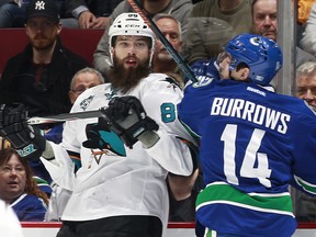 Alex Burrows of the Vancouver Canucks collides with Brent Burns of the San Jose Sharks during the Sharks' 4-1 win in Vancouver on Sunday. San Jose is back again tonight. (Photo by Jeff Vinnick/NHLI via Getty Images)