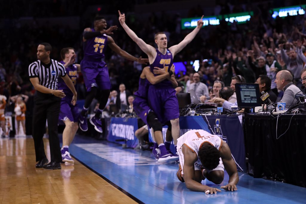 OKLAHOMA CITY, OK - MARCH 18: Isaiah Taylor #1 of the Texas Longhorns reacts after Paul Jesperson #4 of the Northern Iowa Panthers hit a half court three pointer to win the game with a score of 75 to 72 during the first round of the 2016 NCAA Men's Basketball Tournament at Chesapeake Energy Arena on March 18, 2016 in Oklahoma City, Oklahoma. (Photo by Ronald Martinez/Getty Images)