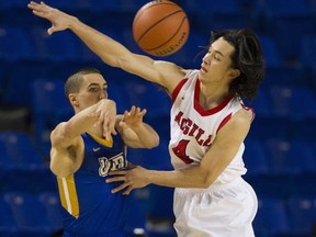 UBC Thunderbirds' Phil Jalalpoor (left) has his pass deflected by McGill's Jenning Leung during CIS Final 8 consolation-round contest Friday at The Doug. (PNG photo by Gerry Kahrmann)